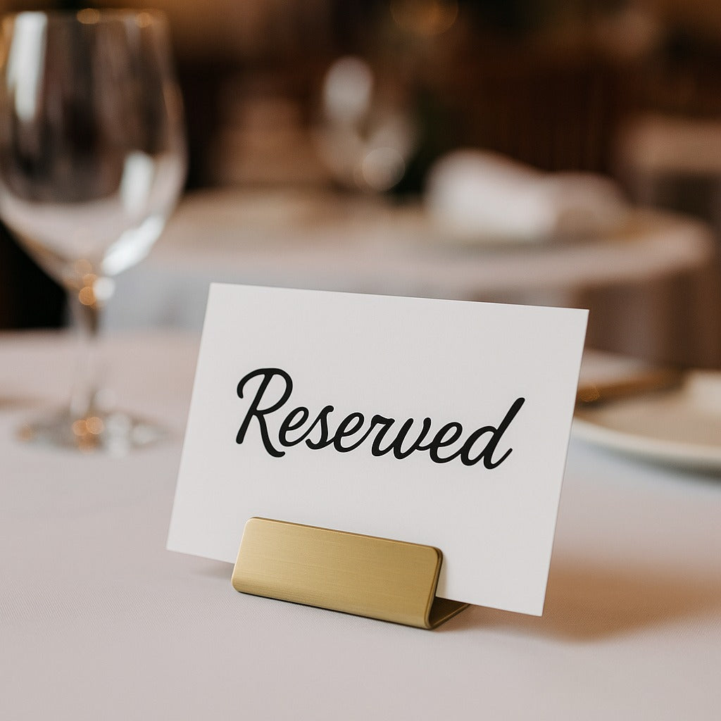 Reserved sign on a table with a blurred background of a restaurant setting