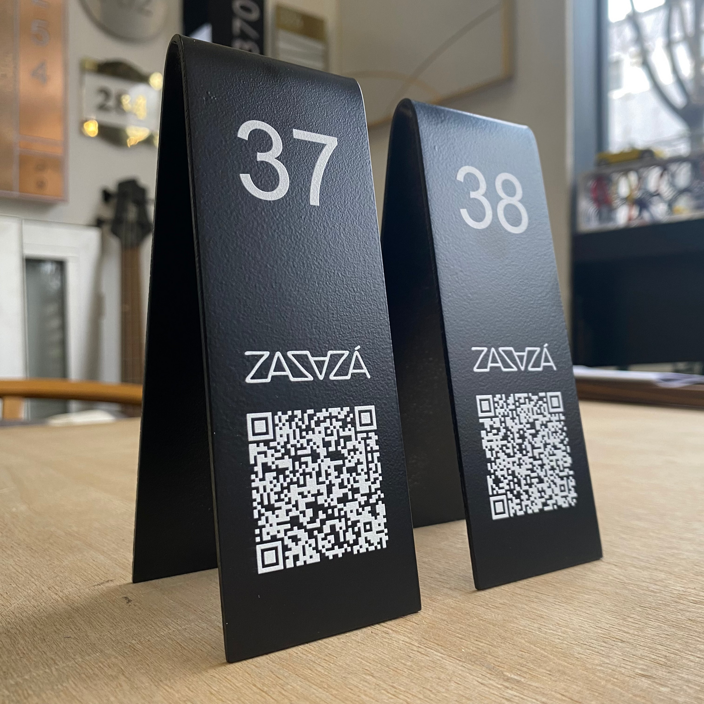 "Double-sided table numbers offering custom printing, perfect for small businesses and cafes. Available with QR code or logo printing for added functionality."