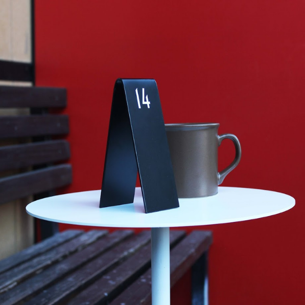 Double-sided Custom Table Number Stackers designed for weddings, cafes, and restaurants. Available with QR code printing and customizable in metal or wood to match any business aesthetic.
