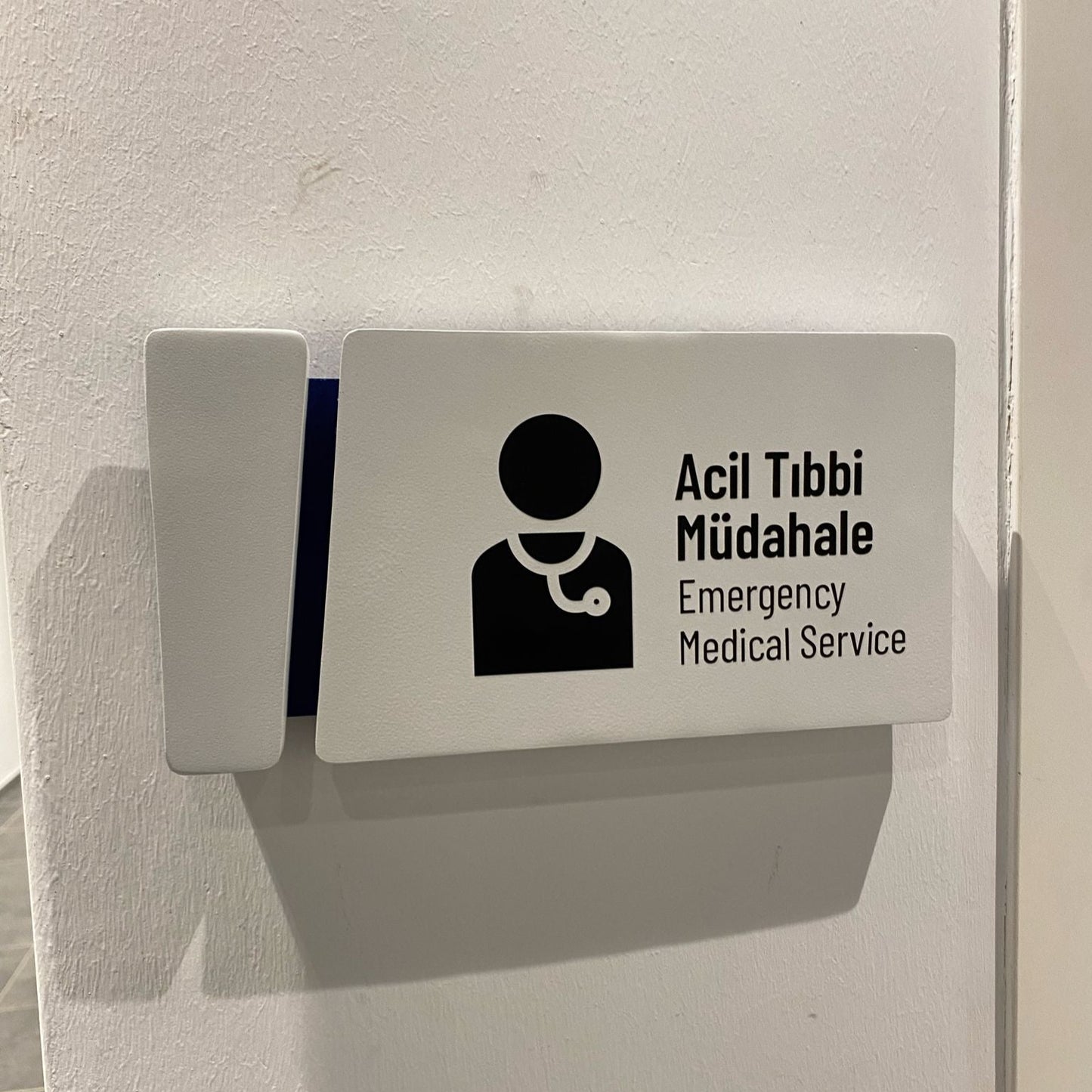 Sign for emergency medical service on a wall