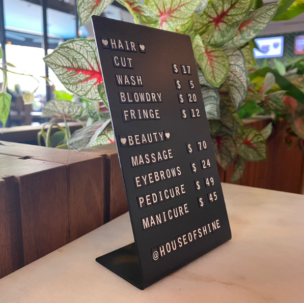 "Magnetic letter counter sign with customizable price list feature, ideal for businesses looking to update pricing or messages frequently."
