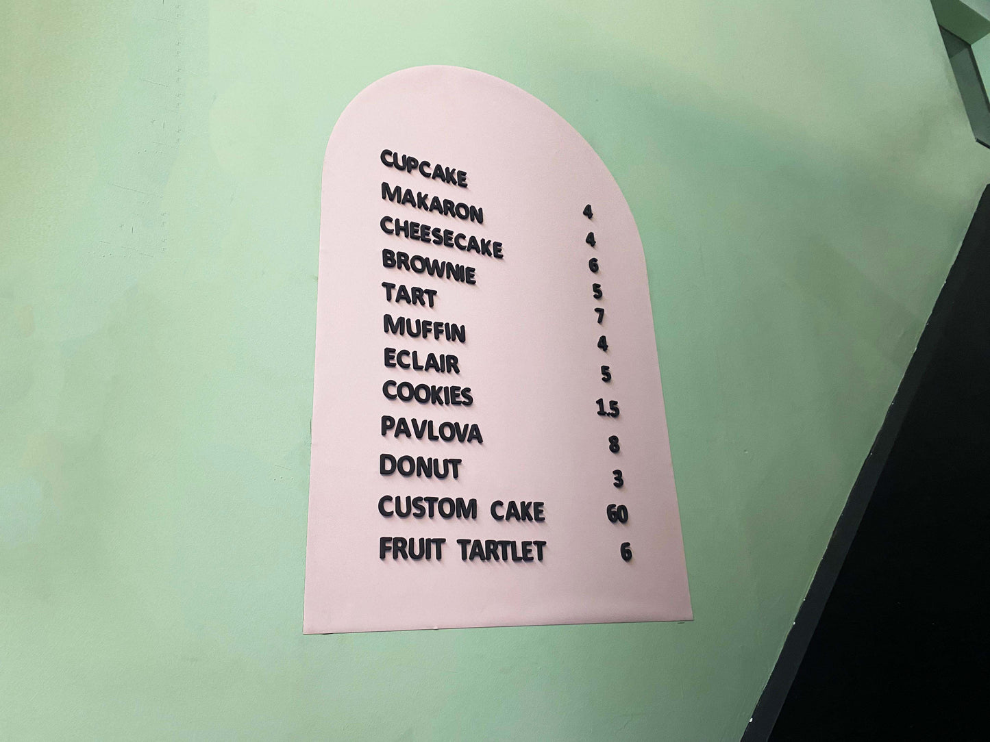 A functional and stylish magnetic menu sign for bakeries, allowing for hassle-free price and menu changes. The board’s flexible metal surface ensures a secure hold for magnetic letters, making it an ideal solution for displaying daily pastry selections, special promotions, or limited-time offers. Whether placed on a countertop or mounted on a wall, this menu sign enhances the visual appeal of bakery displays. Its reusable design reduces paper waste while providing a practical and aesthetically pleasing way