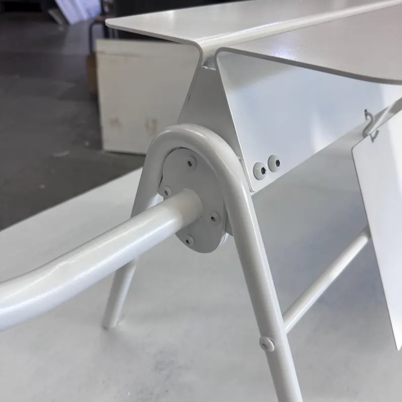 Metallic stand or support structure on a plain background