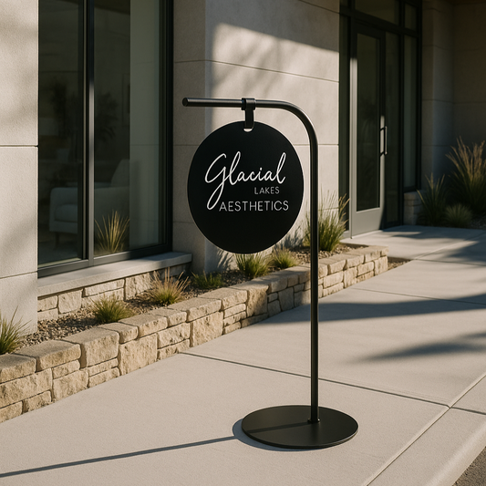 Outdoor sign for 'Glacial Lakes Aesthetics' in front of a modern building.