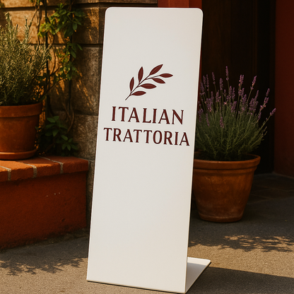 White sign with 'Italian Trattoria' logo in a garden setting