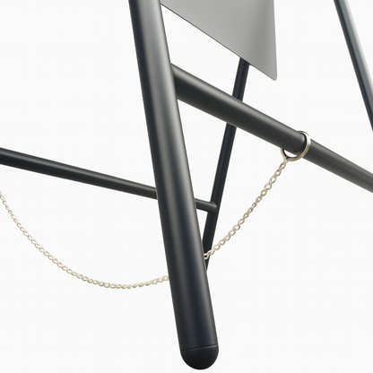 Metallic chair with black legs and a chain on a white background