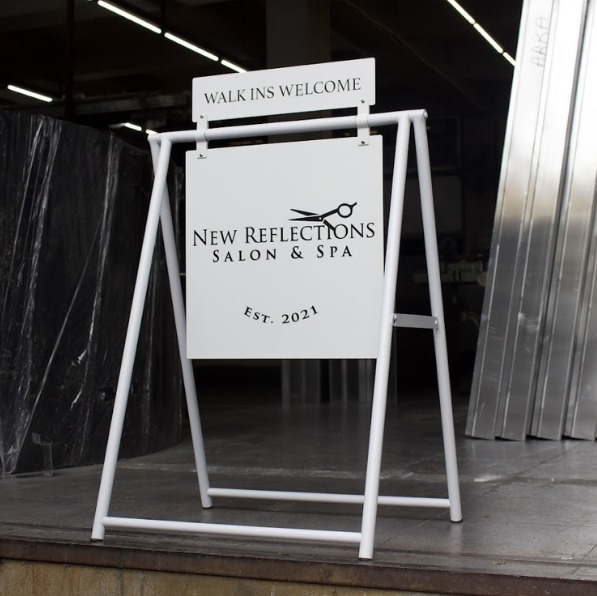 A Frame sidewalk sign with header shown in the workshop.