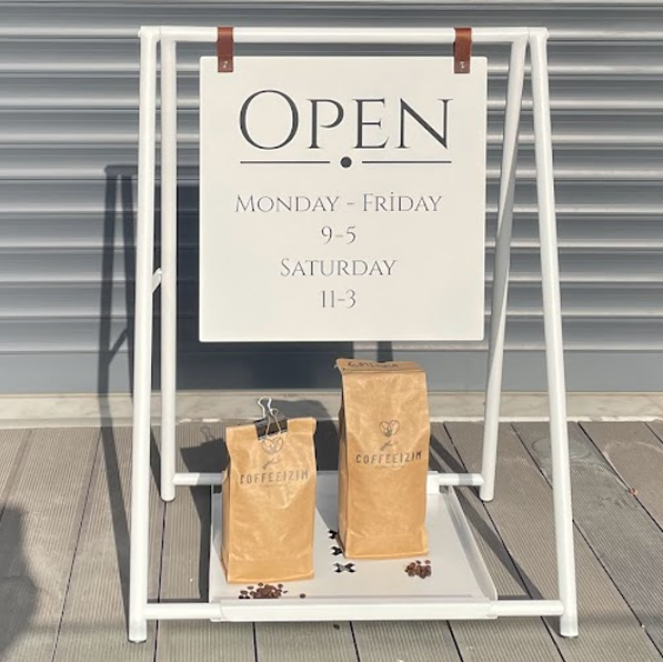 Double-sided A-frame sidewalk sign with a tray for small businesses, offering a practical solution for displaying promotions or menus. The tray beneath the sign adds extra space for promotional items, making it a versatile tool. Also known as a ‘small business sign’ or ‘cafe sign,’ this sign is durable and attention-grabbing.

