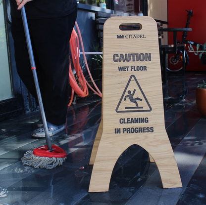 Great for hotels and cafes, this double-sided wooden wet floor sign is available blank or printed. It provides a professional look while ensuring customer safety.