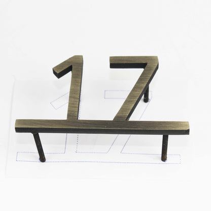 This modern door number sign features clean lines and a simple yet striking metallic finish. Its minimalist design seamlessly integrates into different architectural styles, from contemporary offices to high-end apartments. The reflective surface catches light beautifully, enhancing visibility while maintaining an understated elegance. A must-have for those who appreciate modern aesthetics and practicality.

