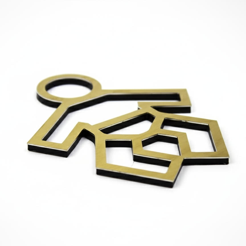 Gold and black geometric key-shaped objects on a white background