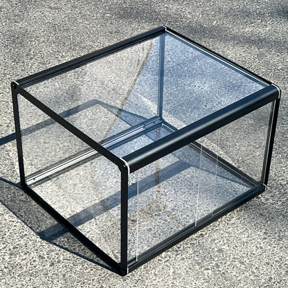 Glass display case on a concrete surface