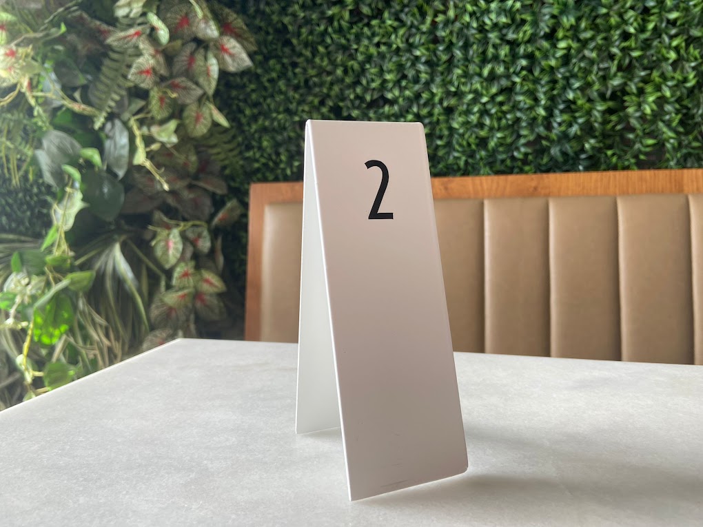 "Double-sided table numbers offering custom printing, perfect for small businesses and cafes. Available with QR code or logo printing for added functionality."

metal table numbers