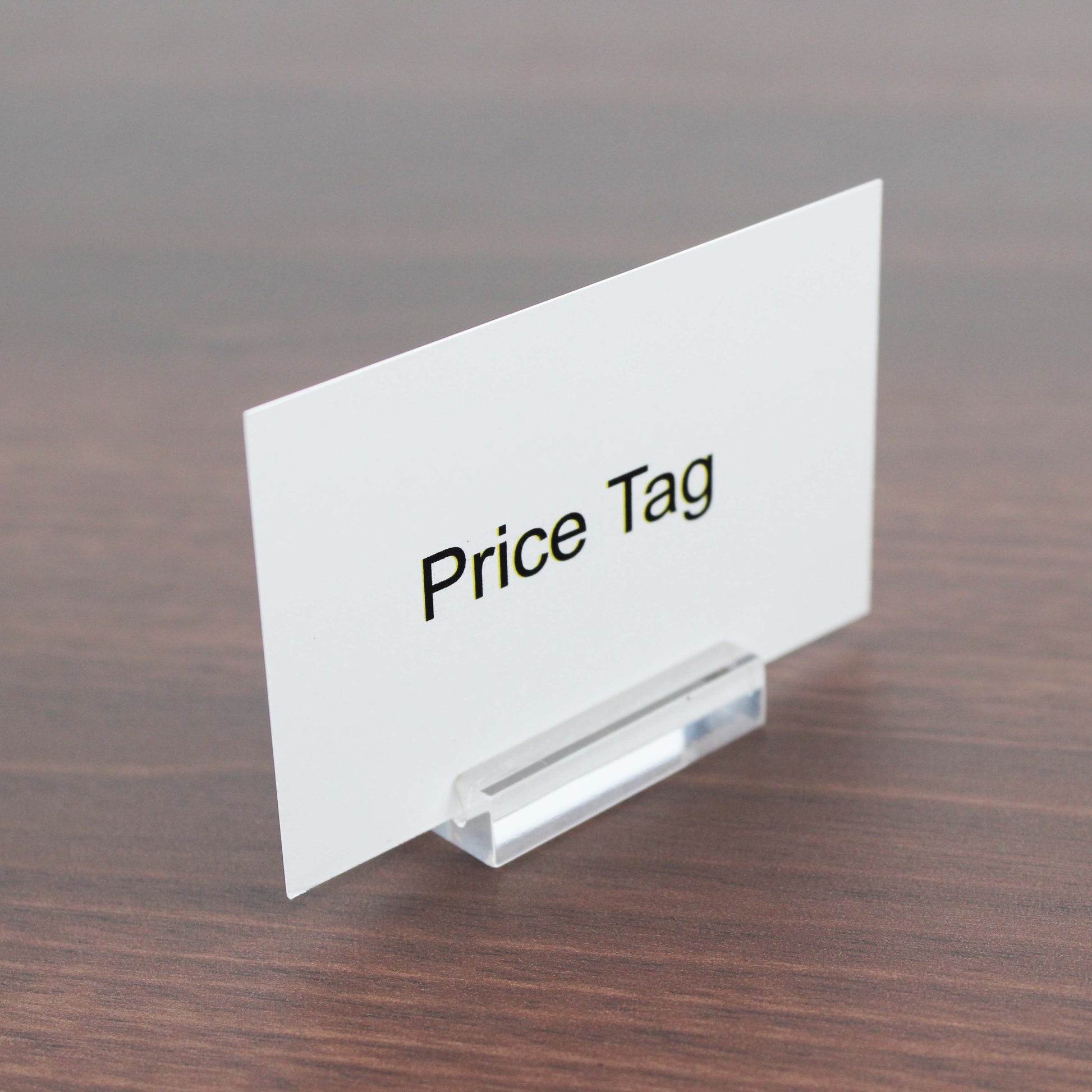 The minimalist card holder, made from durable acrylic, enhances the look of any retail display by showcasing price tags or names with clarity and elegance.