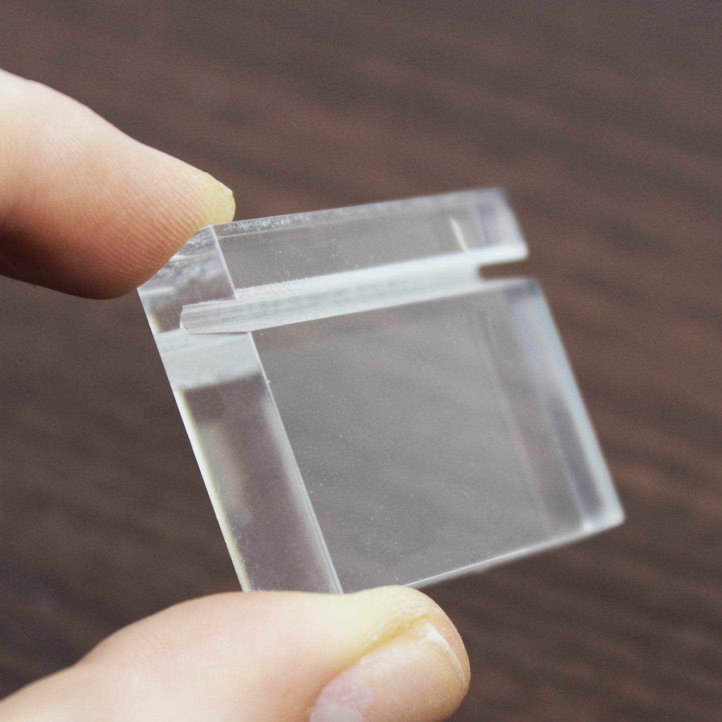 A sleek acrylic card holder, ideal for cafes or retail stores, presents information such as product prices or name tags while complementing any workspace decor.

