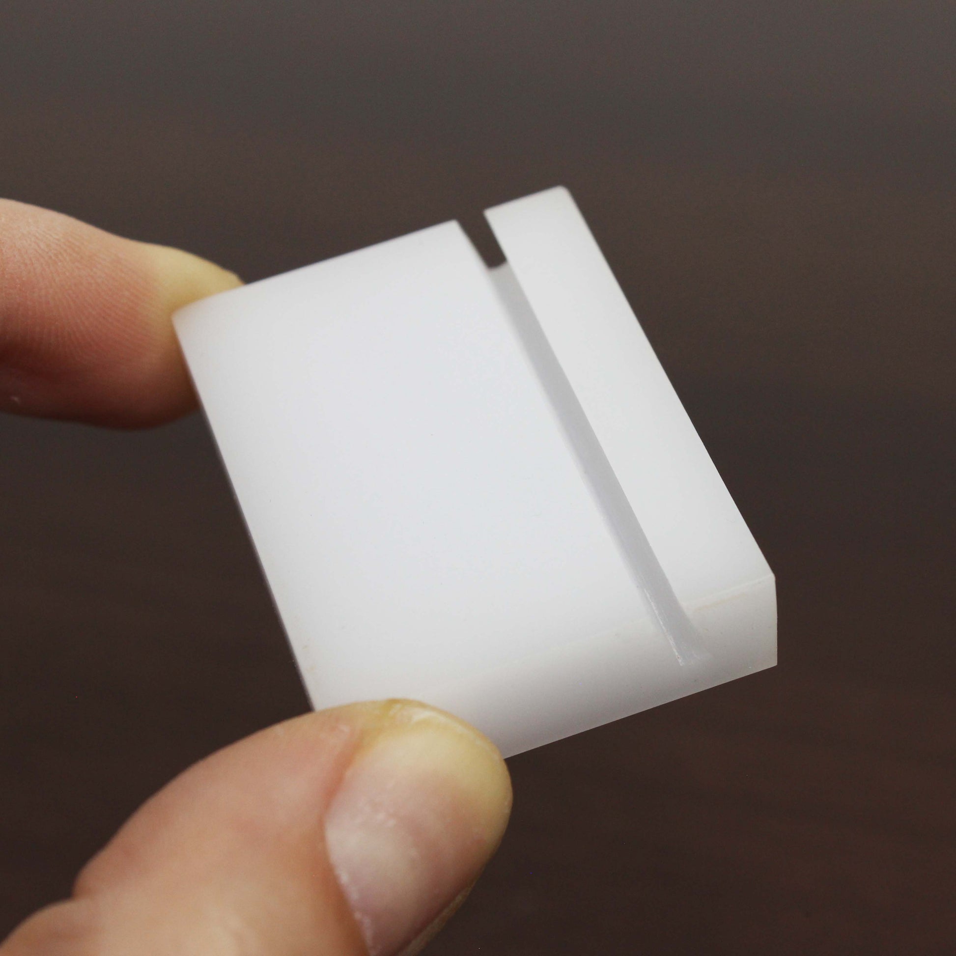 With its compact and elegant design, the minimalist card holder is a versatile solution for organizing name tags or price signs in any retail or office setting.

