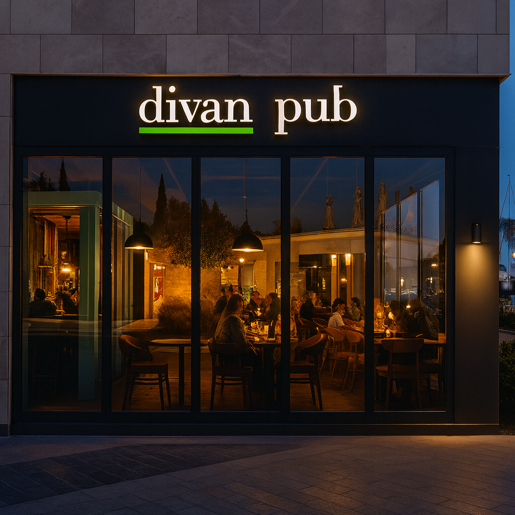 Divan Pub entrance at night with interior lights visible