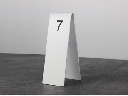 "Personalized double-sided table numbers, perfect for cafes and restaurants. Customization options include QR codes, logos, and reserved signs."

