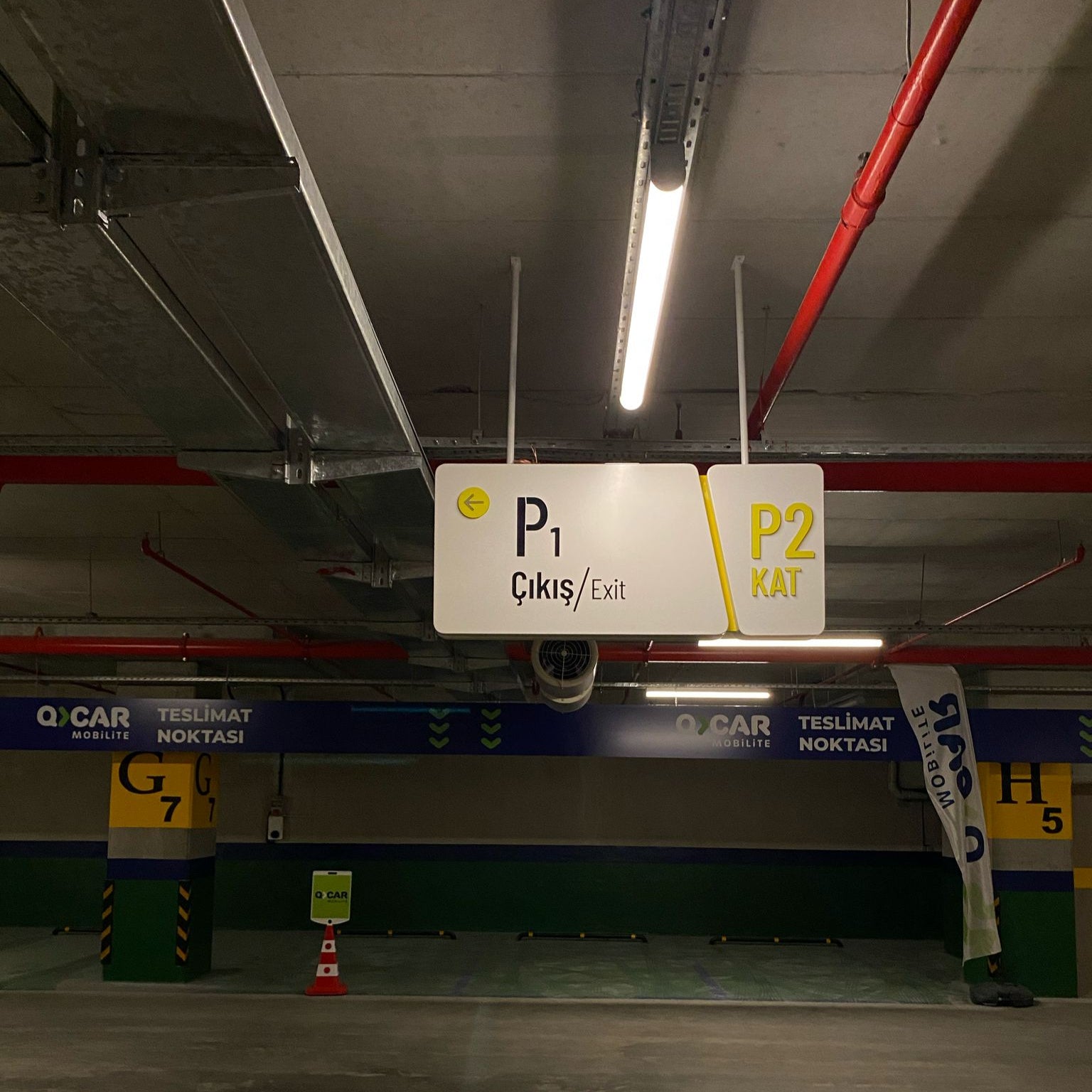 Parking garage interior with a sign indicating levels P1 and P2.