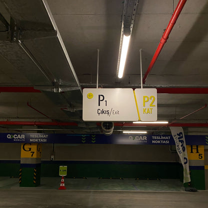Parking garage interior with a sign indicating levels P1 and P2.