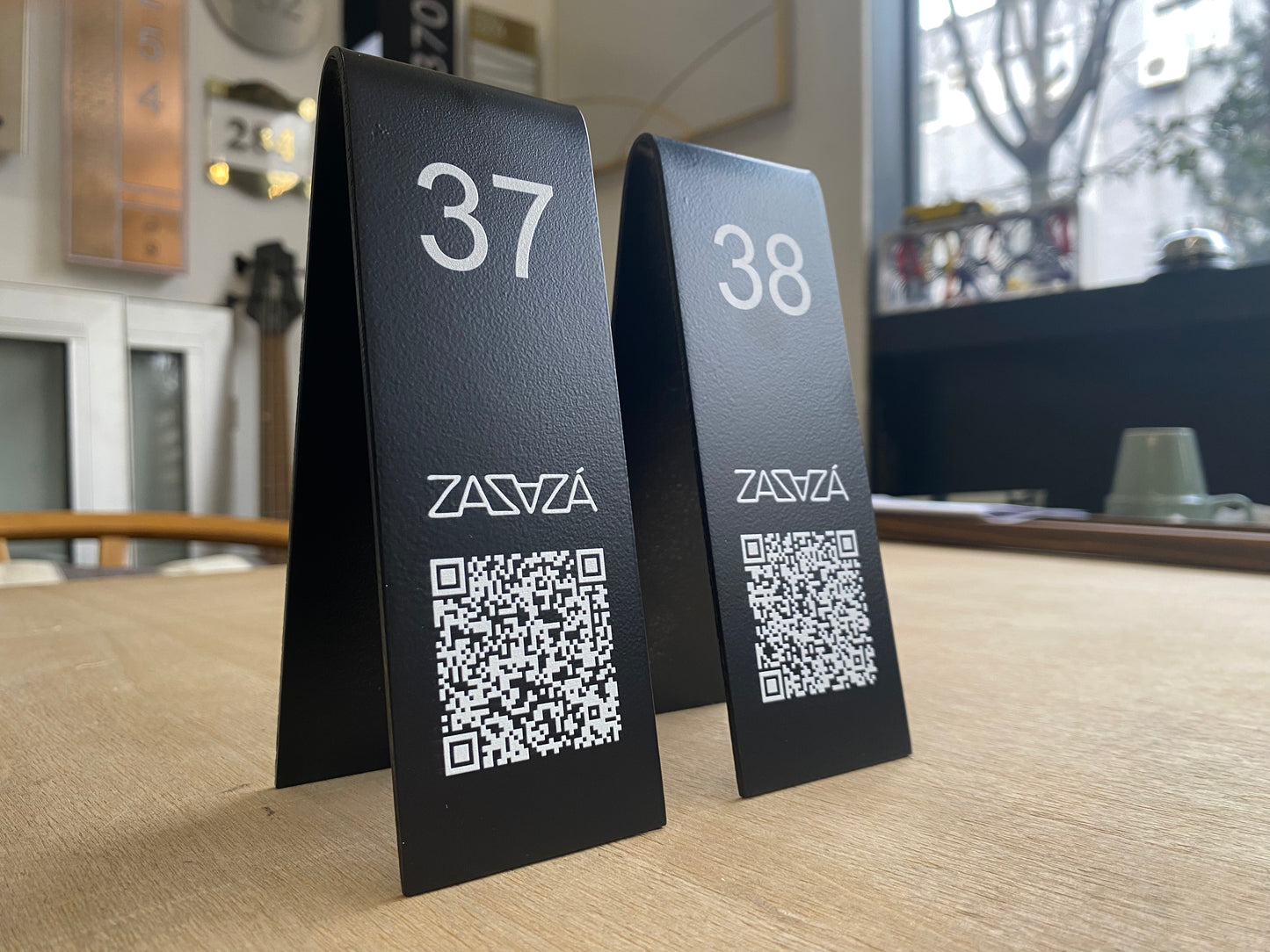 "Double-sided table numbers offering custom printing, perfect for small businesses and cafes. Available with QR code or logo printing for added functionality."

