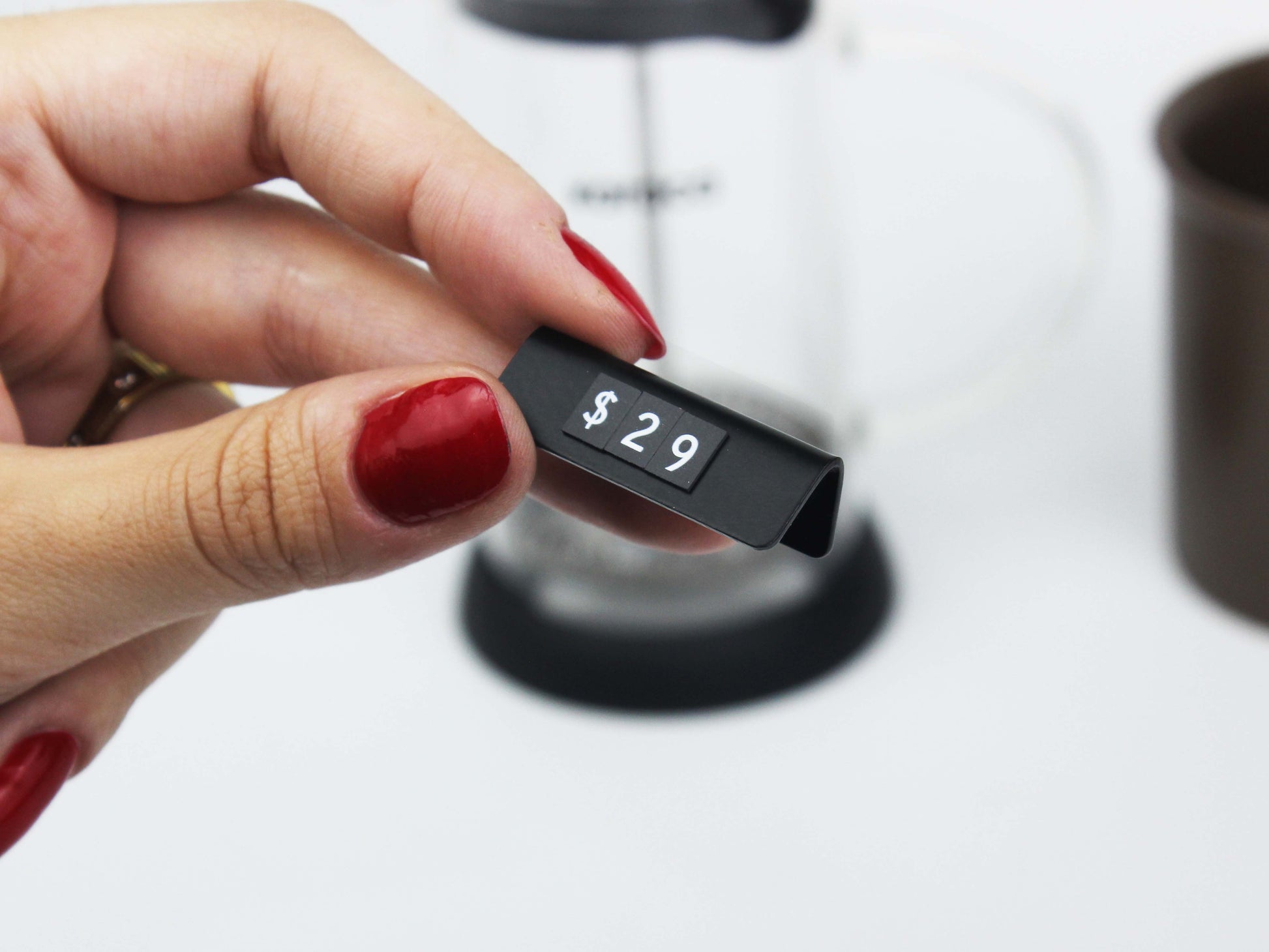 Enhance your store’s visual appeal with a sleek pricing tag on a modern wooden counter.

Transform your retail displays with magnetic pricing tags designed for a sleek, professional appearance and easy price updates.