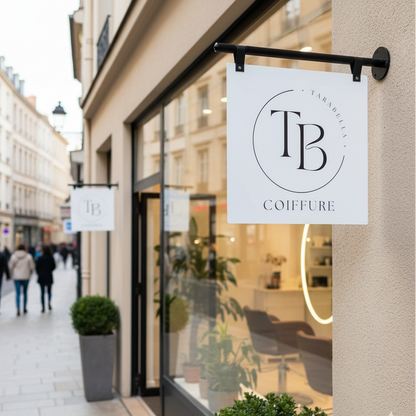 TB Coiffure salon sign on a building exterior with pedestrians in the background