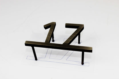 A well-designed hotel room number sign improves the guest experience by offering clear and stylish identification. This polished stainless steel plate elevates hotel interiors, matching various decor styles. Its modern and professional aesthetic adds an upscale feel, enhancing the overall ambiance of the hotel. The easy-to-read numbers ensure quick room recognition, improving both functionality and elegance.

