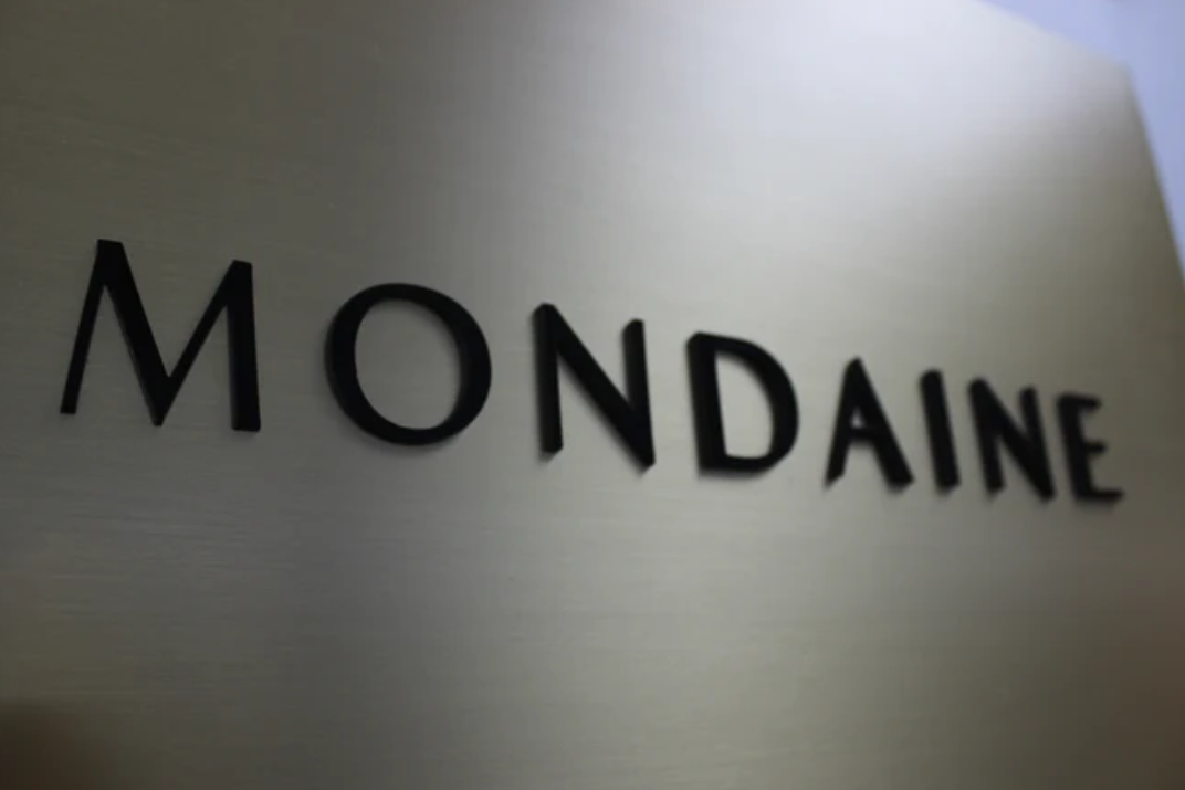 Mondaine logo on a metallic surface