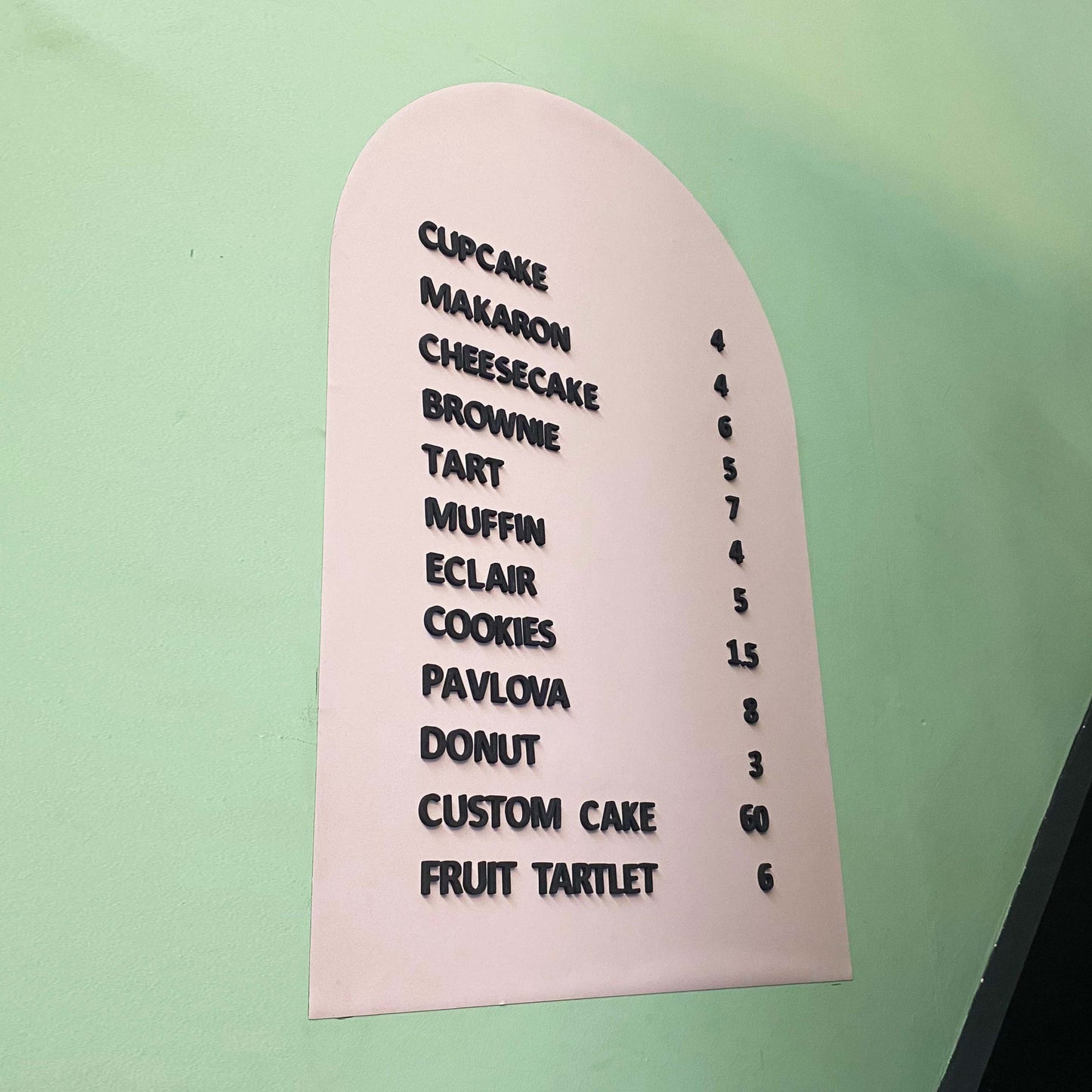 A stylish wall-mounted menu sign with a magnetic surface, perfect for cafés, restaurants, and bakeries. This customizable board allows for easy menu changes using included magnetic letters and numbers. It mounts securely on walls, glass, or counters, providing a professional and polished look. The board is an excellent solution for businesses that frequently update their offerings, from rotating daily specials to new product launches. With a durable design, it’s a long-lasting investment for clear and dynam