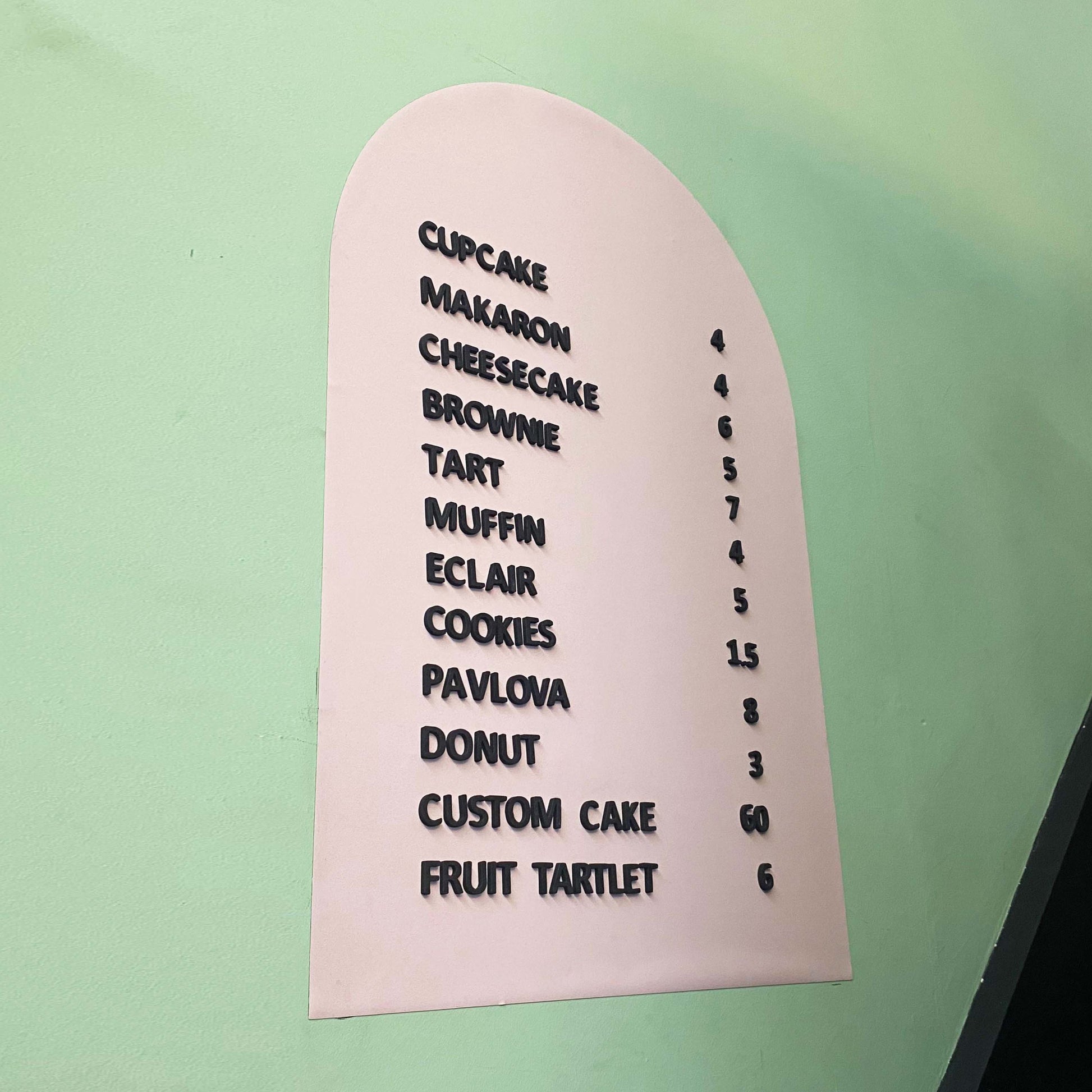 A stylish wall-mounted menu sign with a magnetic surface, perfect for cafés, restaurants, and bakeries. This customizable board allows for easy menu changes using included magnetic letters and numbers. It mounts securely on walls, glass, or counters, providing a professional and polished look. The board is an excellent solution for businesses that frequently update their offerings, from rotating daily specials to new product launches. With a durable design, it’s a long-lasting investment for clear and dynam