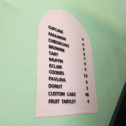 A stylish wall-mounted menu sign with a magnetic surface, perfect for cafés, restaurants, and bakeries. This customizable board allows for easy menu changes using included magnetic letters and numbers. It mounts securely on walls, glass, or counters, providing a professional and polished look. The board is an excellent solution for businesses that frequently update their offerings, from rotating daily specials to new product launches. With a durable design, it’s a long-lasting investment for clear and dynam