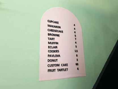 A sleek and modern magnetic letter menu board designed for cafés and coffee shops. The board features a high-quality metal surface that securely holds changeable white magnetic letters, making it easy to update menus, prices, or special offers. Its minimalist black design complements various interiors, from rustic coffee houses to contemporary cafés. Ideal for daily updates, seasonal promotions, and highlighting featured drinks, this magnetic menu board adds both style and functionality to any business.