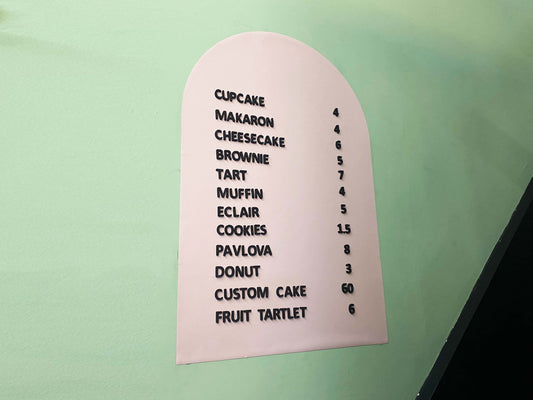 A sleek and modern magnetic letter menu board designed for cafés and coffee shops. The board features a high-quality metal surface that securely holds changeable white magnetic letters, making it easy to update menus, prices, or special offers. Its minimalist black design complements various interiors, from rustic coffee houses to contemporary cafés. Ideal for daily updates, seasonal promotions, and highlighting featured drinks, this magnetic menu board adds both style and functionality to any business.
