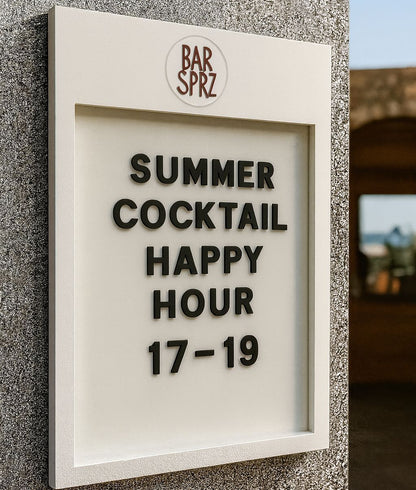 Advertisement for a summer cocktail happy hour at Bar Sprz on a textured wall.