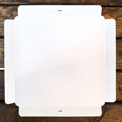 White screen protectors on a wooden surface