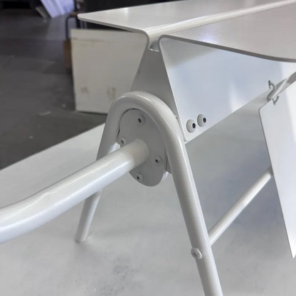 Metallic stand or support structure on a plain background