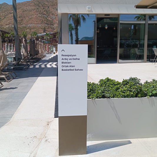 Modern building entrance with a sign in an outdoor setting