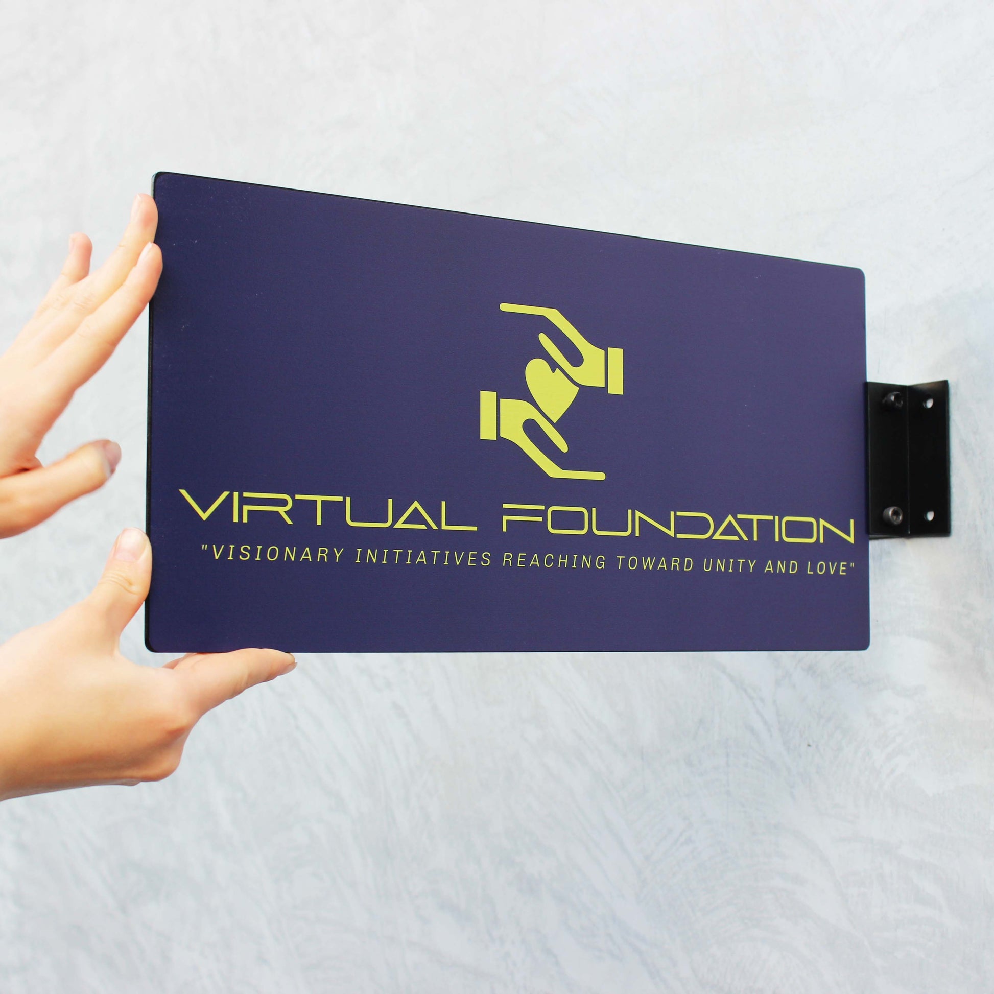 Purple plaque with 'Virtual Foundation' logo and text on a gray background