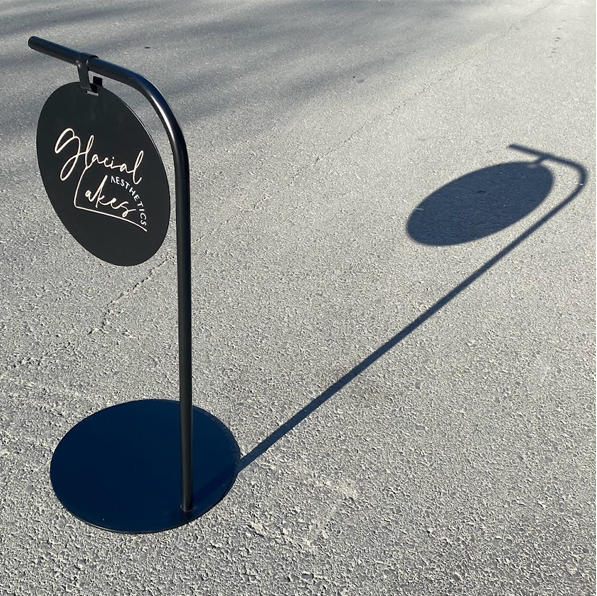 Customizable round panel sidewalk sign, ideal for promoting sales or daily specials. Made with durable materials and perfect for small business branding.
