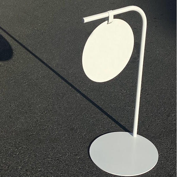 Custom-printed round panel sidewalk sign, perfect for advertising special offers or daily menus outside of cafes, restaurants, or boutiques.

