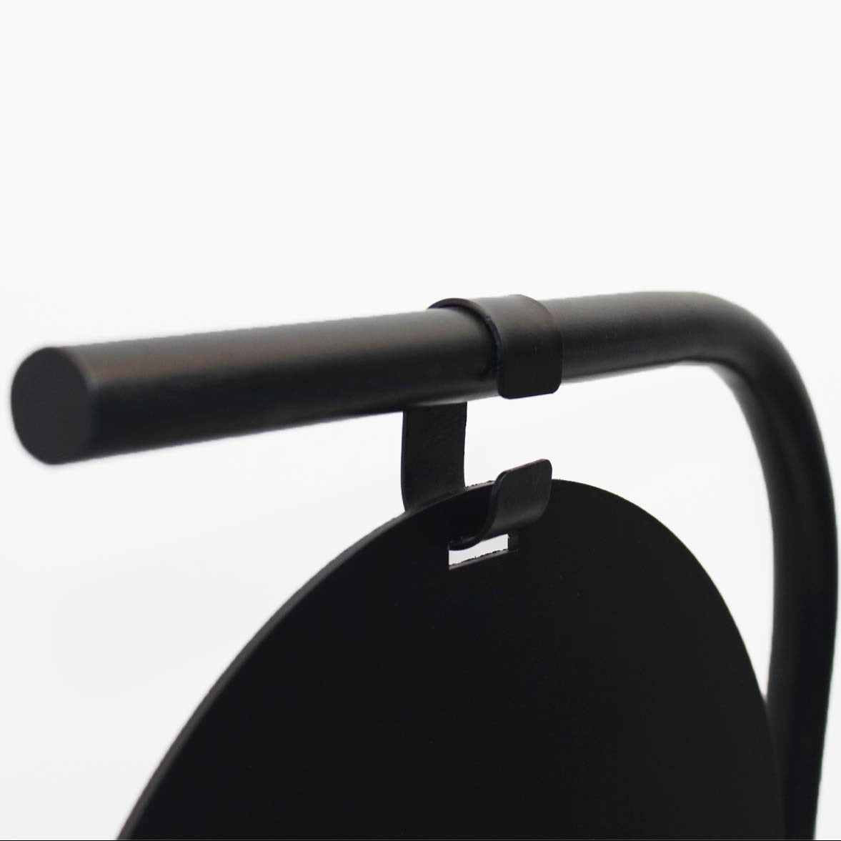 Close-up of a black bicycle handlebar on a white background