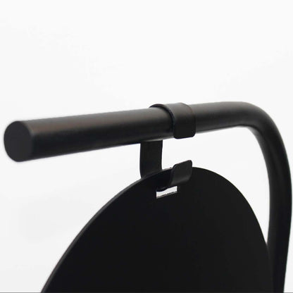 Close-up of a black bicycle handlebar on a white background