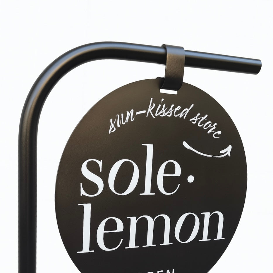 Round sign for 'sole lemon' store with black background and white text.