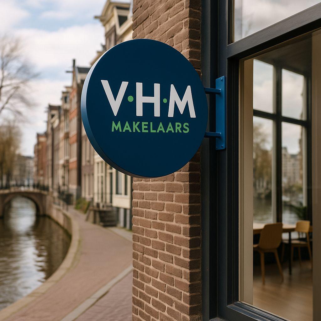 VHM Makelaars sign on a brick building with a canal view