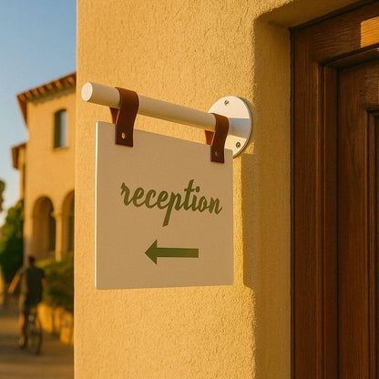 Reception sign on a yellow wall with a blurred background