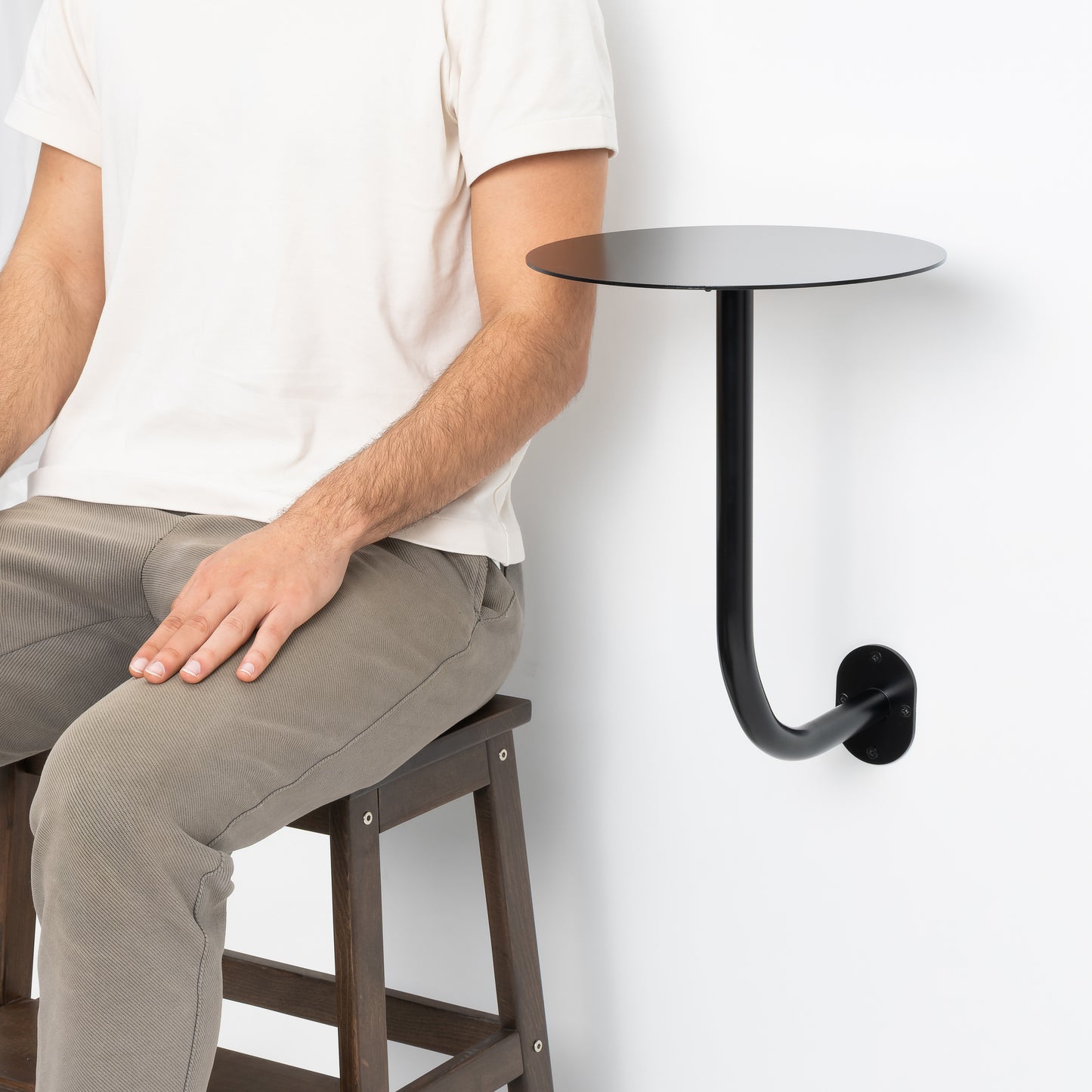 Wall mounted round table ideal for modern café interiors.
