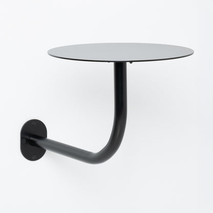 Customizable wall table with adjustable metal support.