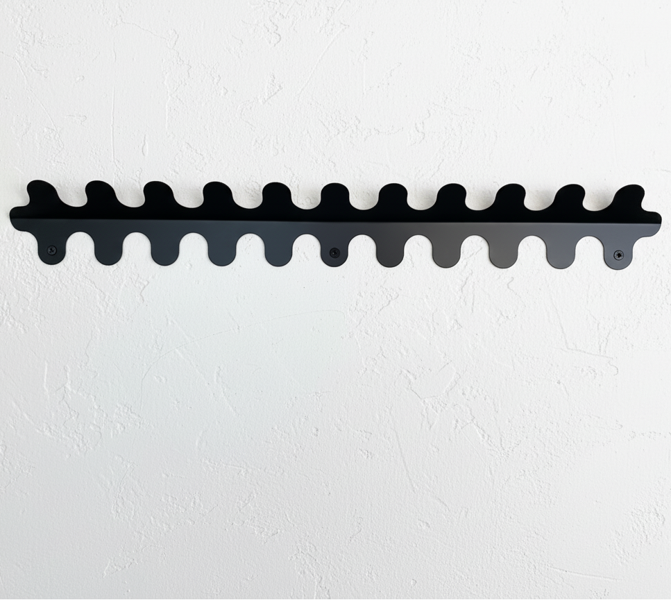 Black wavy shelf on a white wall