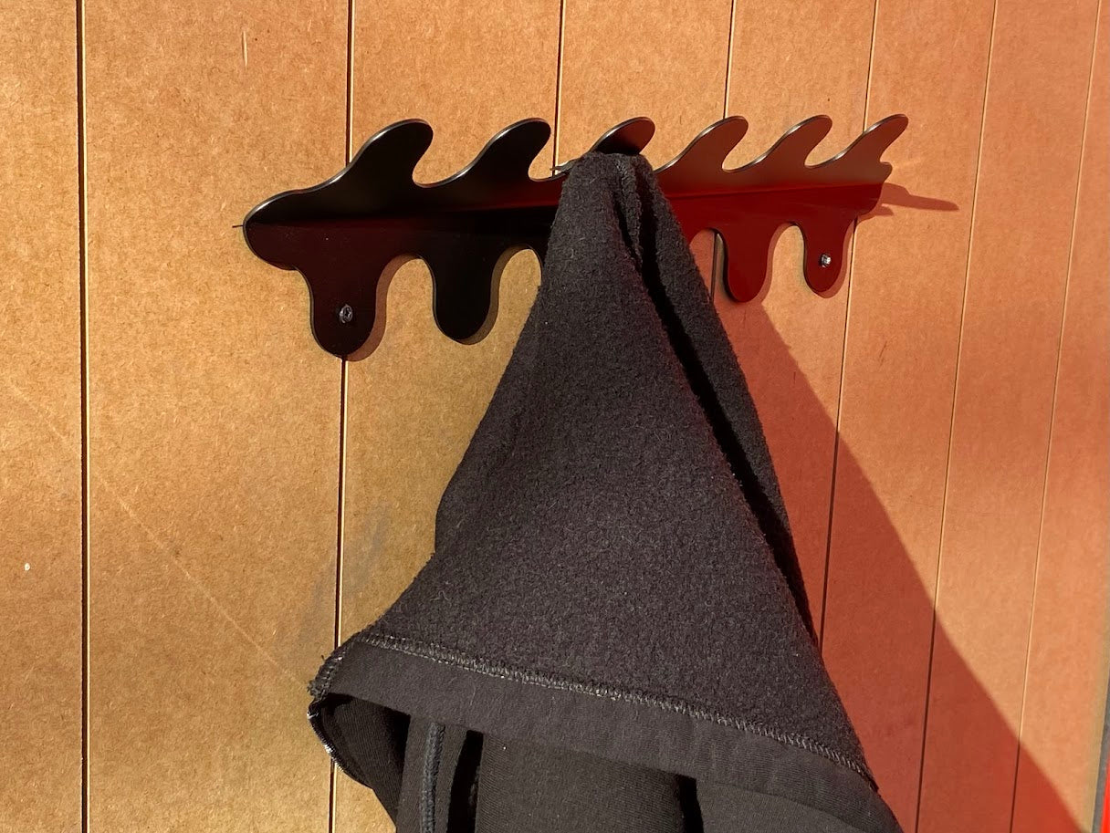 This wall-mounted metal hanger is crafted from durable materials that ensure long-lasting use. Its sleek, sturdy structure supports multiple items without bending or breaking. Whether in your entryway, office, or hotel room, it blends practicality with modern design. The hanger’s simple yet elegant look is perfect for keeping your space neat while adding a touch of sophistication.

